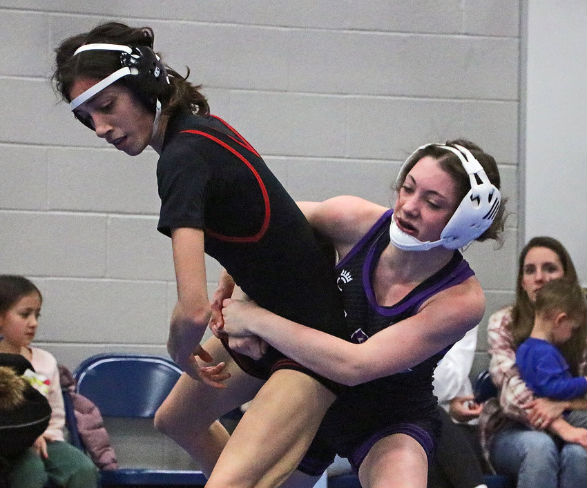 Blair 100-pounder Riley Martin, right, works to drag Auburn's Malia Stewart to the mat Friday at Plattsmouth High School.