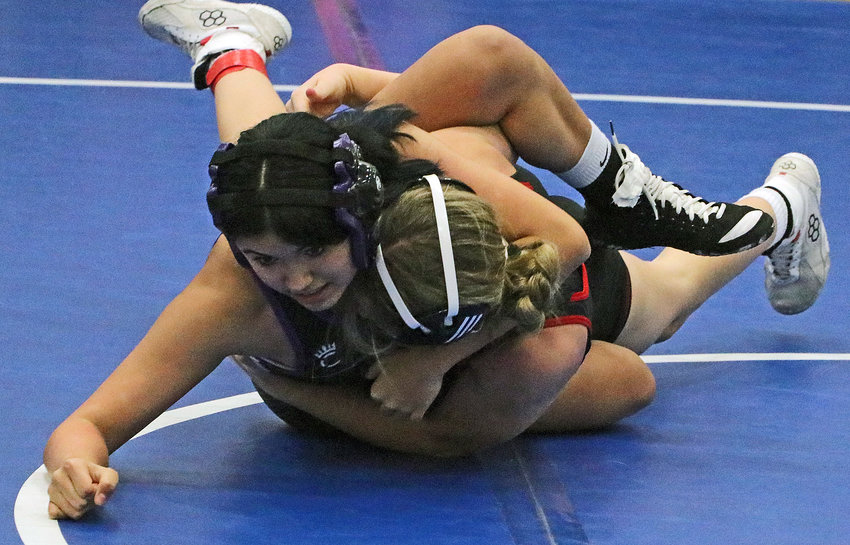 The Bears' Maia Opetaia-Swope, left, grapples with Mia Gerdes of Auburn on Friday at Plattsmouth High School.