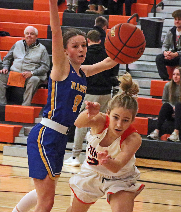 The Pioneers' Ari Nelson, right, is fouled by Logan View's Elli Christianson and loses the ball out of bounds Saturday at Fort Calhoun High School.