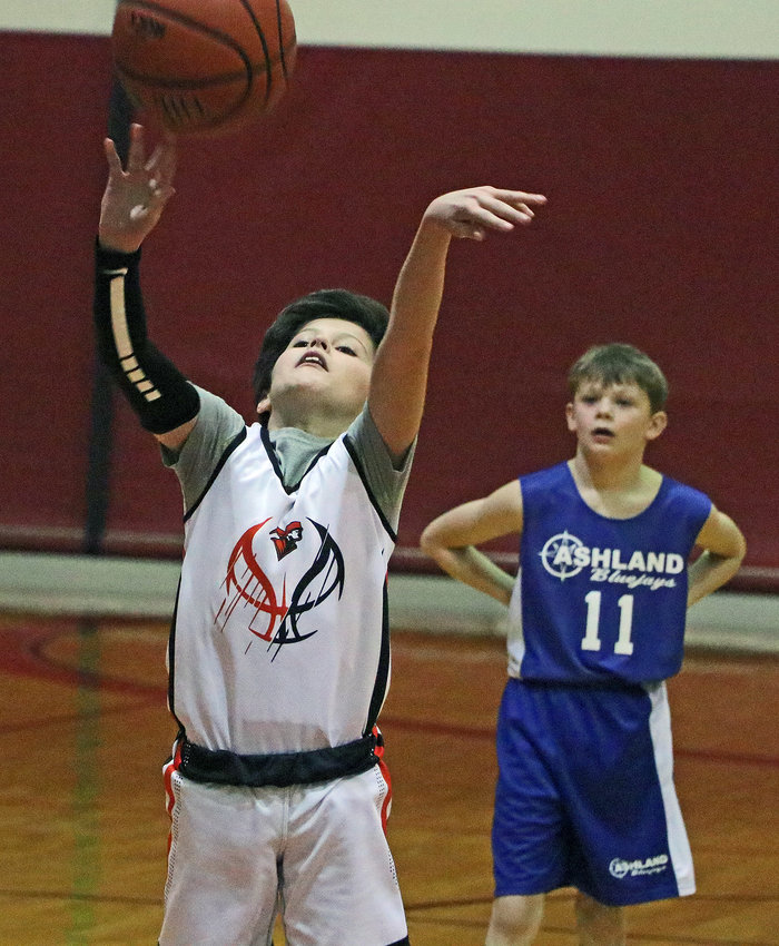 Brecken O'Connor of the Fort Calhoun Youth Sports Organization fifth-grade team shoots a free throw Saturday at Gardner-Hawks Center.