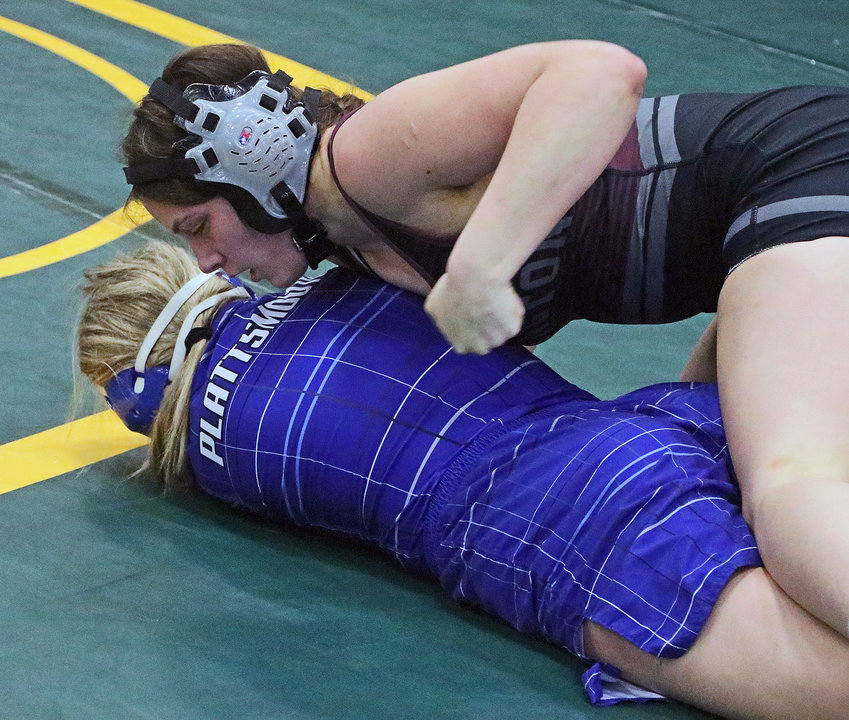 Arlington's Jaydin Allen, top, controls a district match with Plattsmouth's Olivia Byrom on Friday at Fremont High School.