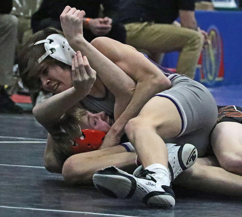 Blair's Hudson Loges, top, pins Hastings' Zane Thomsen on Saturday at the Buffalo County Fairgrounds.