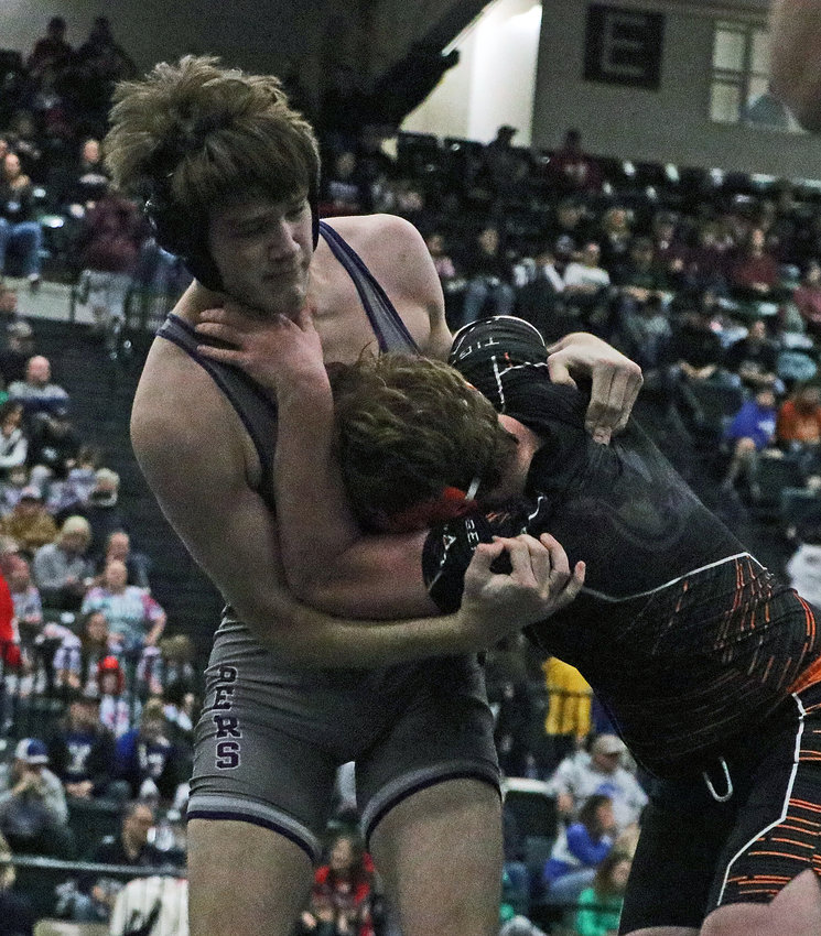 Blair 220-pounder Jim Rasmussen, left, competes against Hastings' Kelyn Jones on Saturday at the Buffalo County Fairgrounds.
