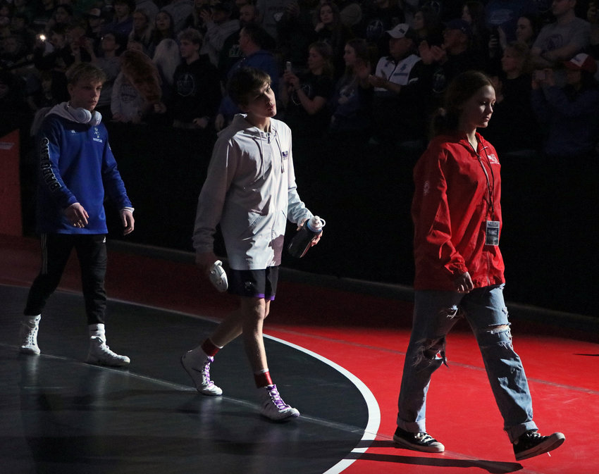 Blair's Hudson Loges, middle, takes part in the Parade of Champions prior to the NSAA State Championship finals Saturday in Omaha.