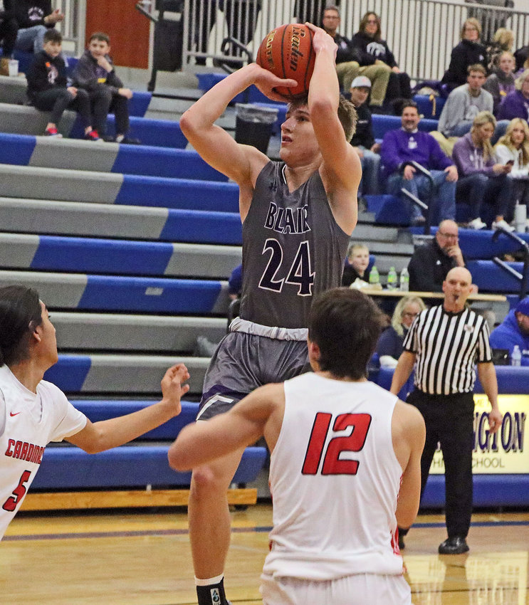 Blair senior Greyson Kay pulls up for a jump shot in the lane against South Sioux City on Wednesday at Bennington High School.