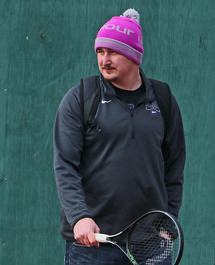 New Blair High School tennis coach David Christensen watches practice Tuesday at Stemmermann Park.