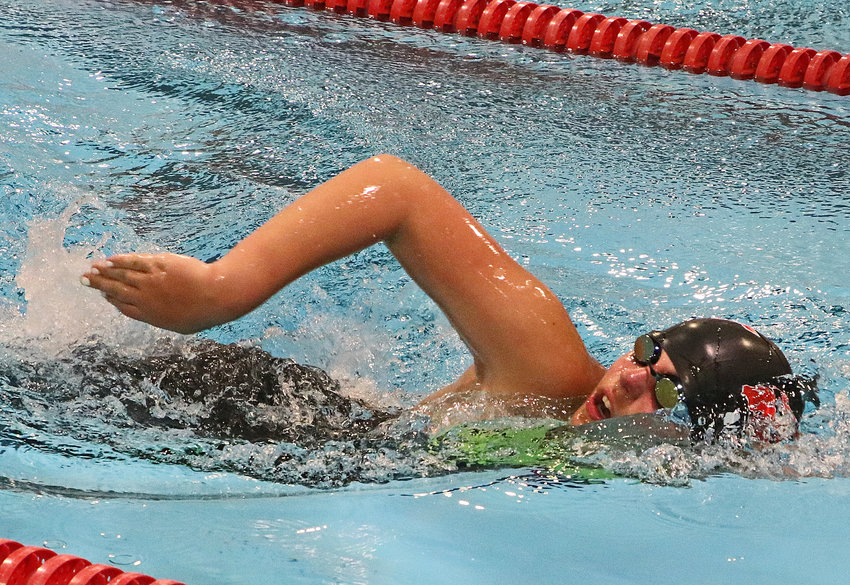 The Fremont Area Swim Team's Hannah Huenink of Washington County competes Saturday in Fremont.