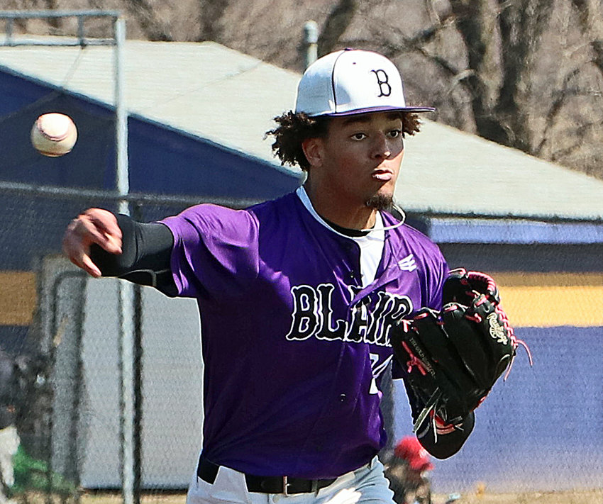 Blair pitcher J'Shawn Unger throws to first base for a pick-off attempt Saturday at Bellevue West.