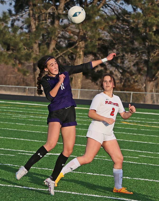 Blair's Brynn Ray, left, leaps to head the ball in front of Platteview's Alli Bowen on Friday at Krantz Field.