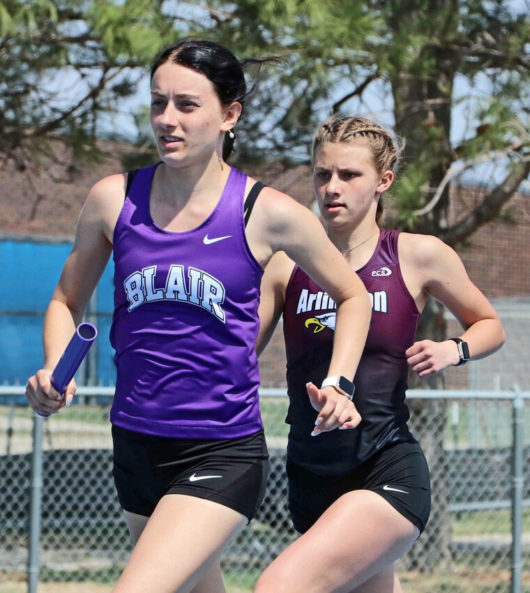 Blair's Reece Ewoldt, left, runs ahead of Arlington's Whitney Wollberg on Friday at Wahoo High School.