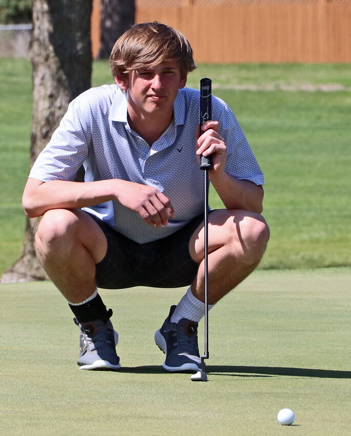Arlington's Eddie Rosenthal sets up on the green in Hooper. On Tuesday, he played his second state round in Columbus.