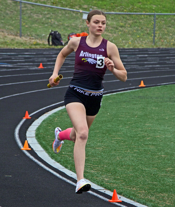 Arlington's Hailey O'Daniel runs the curve Tuesday at Elkhorn High School.