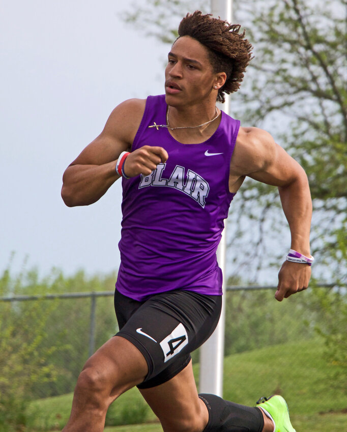 Ethan Baessler of Blair runs the curve Tuesday during a Class B District 2 200-meter dash win at Elkhorn High School.