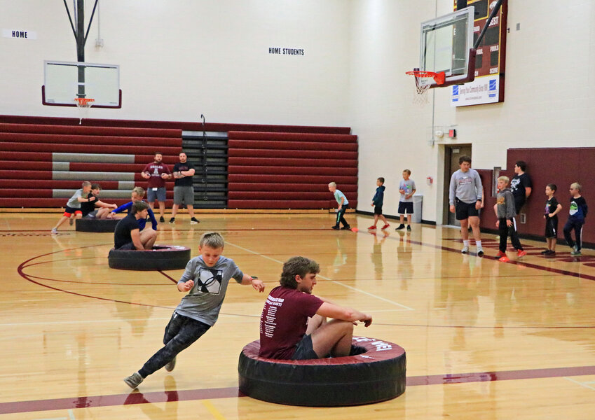 The Arlington Youth Football Camp for grades 2-5 moved indoors Monday with low temperatures outside of AHS.