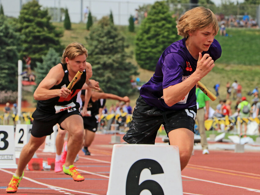 Blair Unified sprinter Cooper Sorensen, right, runs the 400-meter relay Thursday at Omaha Burke Stadium.