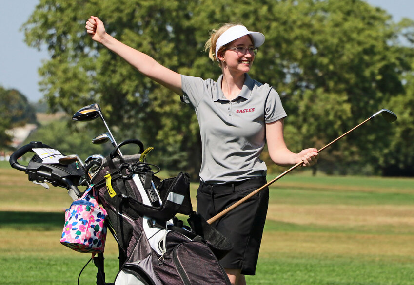 Arlington's Sarah Rhea celebrates a shot down the middle of the 11th fairway Tuesday at River Wilds Golf Club.