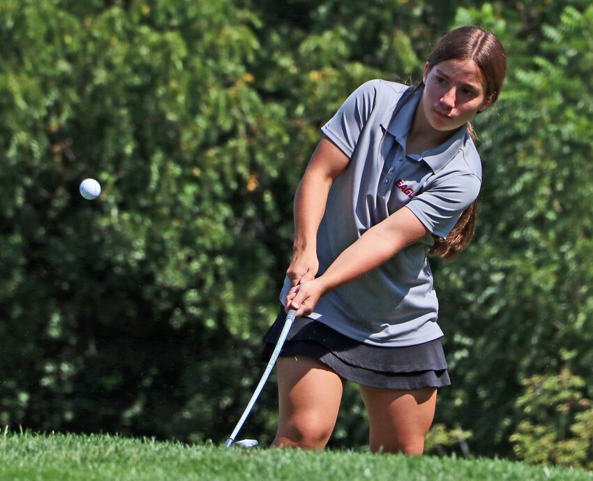 Aspen Smutz of Arlington chips onto the 11th green Tuesday at River Wilds Golf Club.