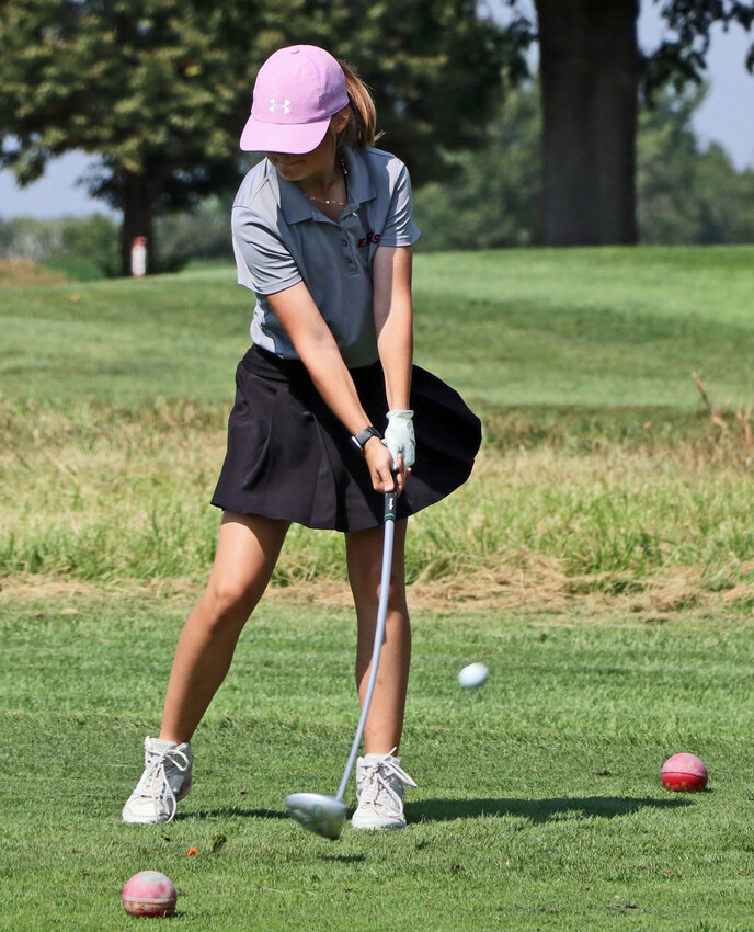 Arlington's Honora Andreasen hits her ball off of the tee Tuesday at River Wilds Golf Club.