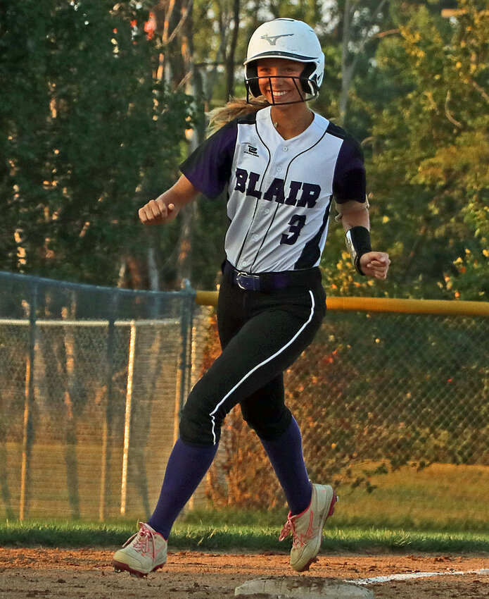 Blair slugger Leah Chances cracks a smile as she makes her way to the plate on a home run trot Monday at Omaha Skutt.