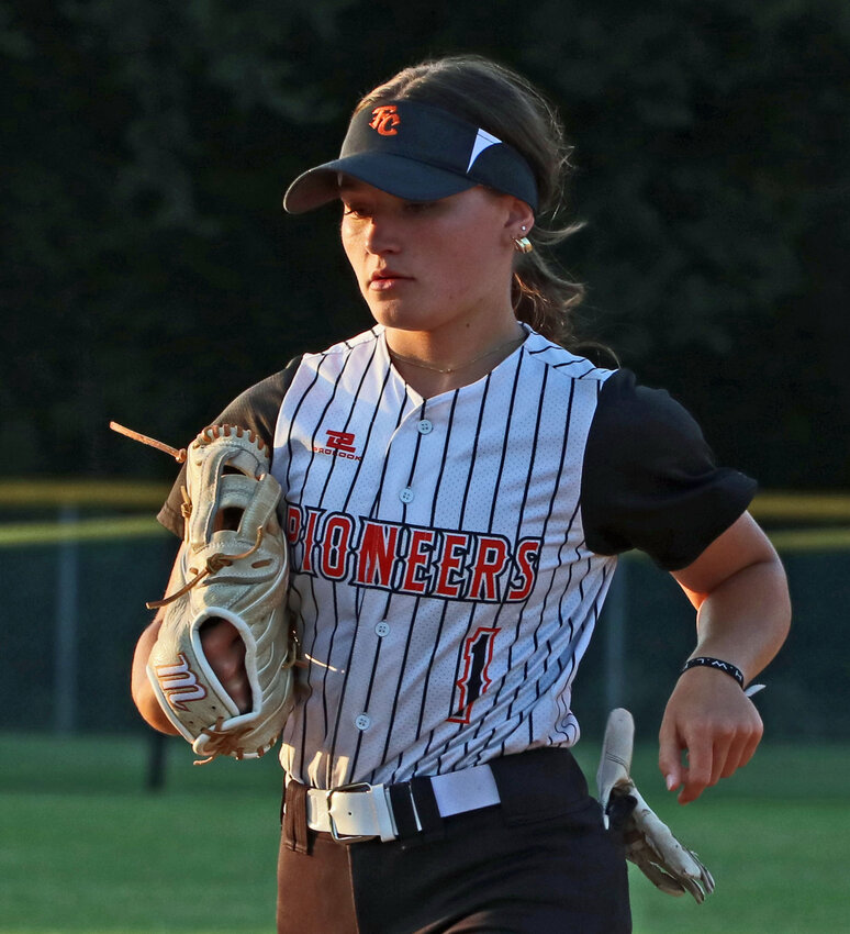 Pioneers outfielder Zoe Gillespie leaves the field of play at the end of an inning Tuesday in Fort Calhoun.