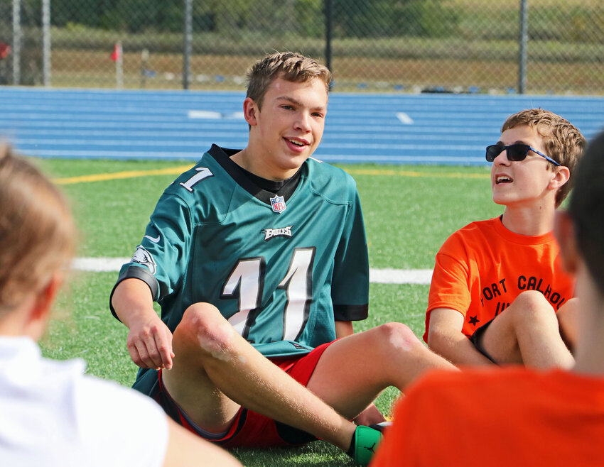 Blair's Riley Yanak, middle, takes a seat during a game of duck, duck, goose Thursday at Bennington High School.
