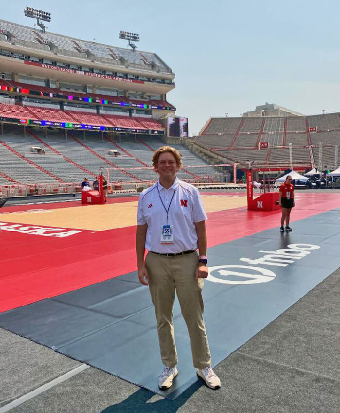 Arlington graduate Lance Vie holds an important position behind the scenes of Nebraska athletics, including when he worked as a director during the Huskers' Aug. 30 volleyball match at Memorial Stadium.