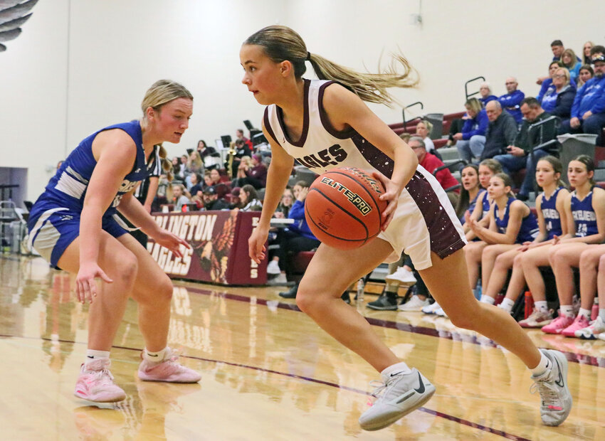 The Eagles' Emme Timm, right, drives baseline against Lakeview on Saturday at Arlington High School.