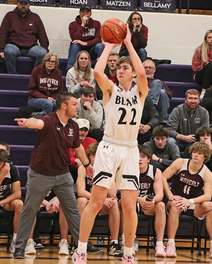 Bears junior Easton Bosanek shoots a 3-pointer in front of the Waverly bench Tuesday at Blair High School.