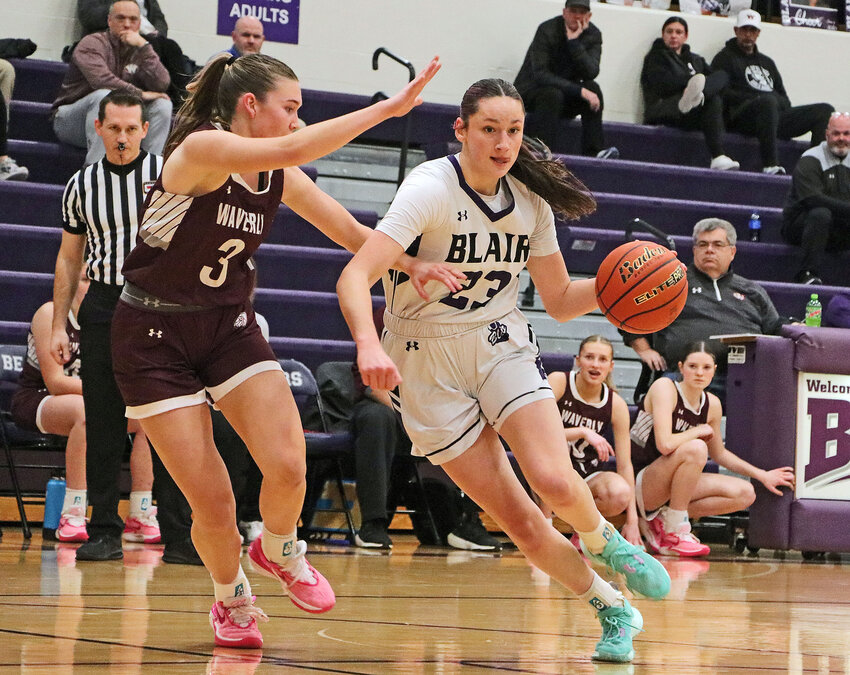 Defended by Waverly's Berkley Lambrecht, left, the Bears' Addie Sullivan works her way into the lane Tuesday at Blair High School.