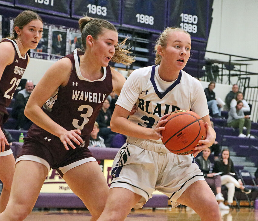 Bears freshman Taytum Macholan, right, looks to pass the ball away from Berkley Lambrecht and the Waverly defense Tuesday at Blair High School.