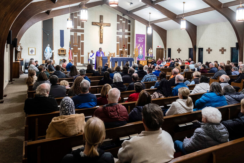 Many parishioners attended a Sunday evening prayer service for Fr. Stephen Gutgsell at St. John the Baptist Catholic Church.