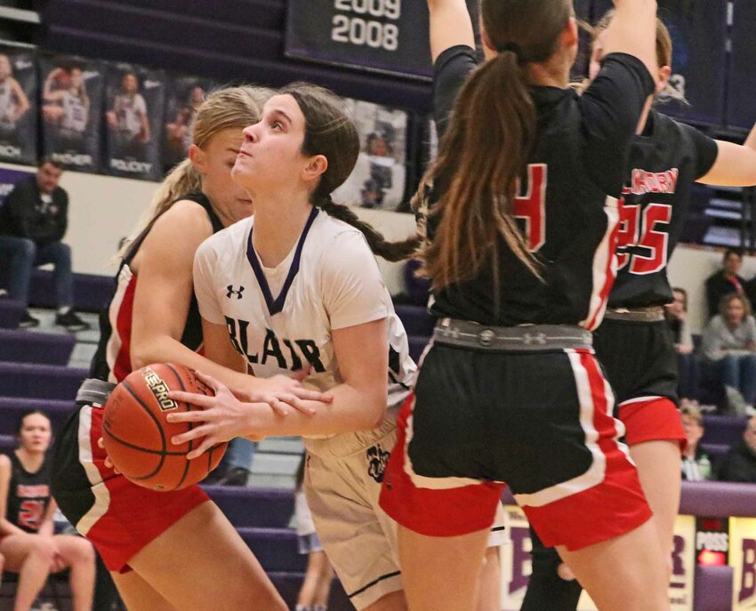 The Bears' Kate Wulf, facing, is fouled in the lane against Elkhorn on Tuesday at Blair High School.