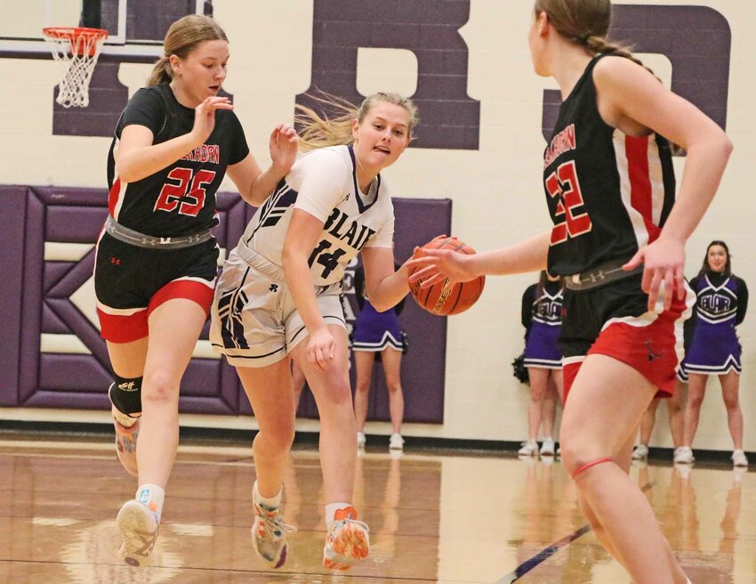 The Bears' Joslyn Policky, middle, dribbles downthe court against the Antlers on Tuesday at Blair High School.