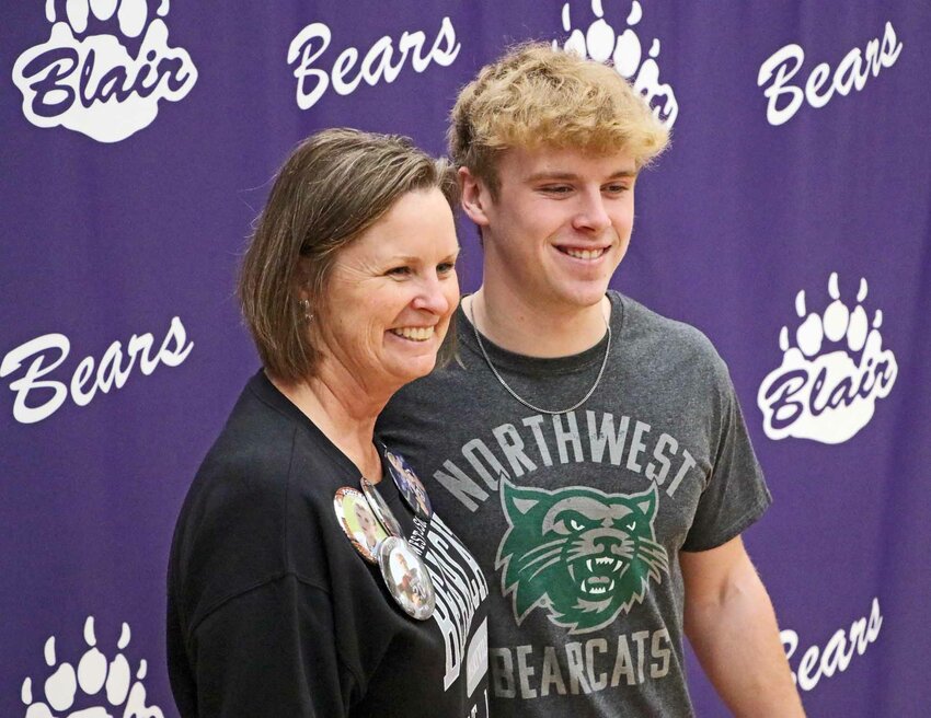 New Northwest Missouri State Bearcat Ben Holcomb poses for a photo with his mother, Blair High School Principal Tammy Holcomb, on Wednesay.