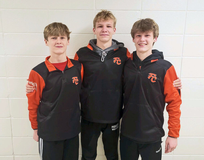 Fort Calhoun wrestlers Merritt Olberding, from left, Gage Nixon and Presley Olberding earned their first state qualifications Saturday in Grand Island.