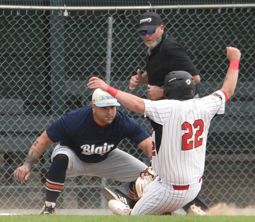 Blair Dawgs third baseman Wilmer Pacheco, left, tags out the West Point Bombers' Josh Wegner on Sunday..