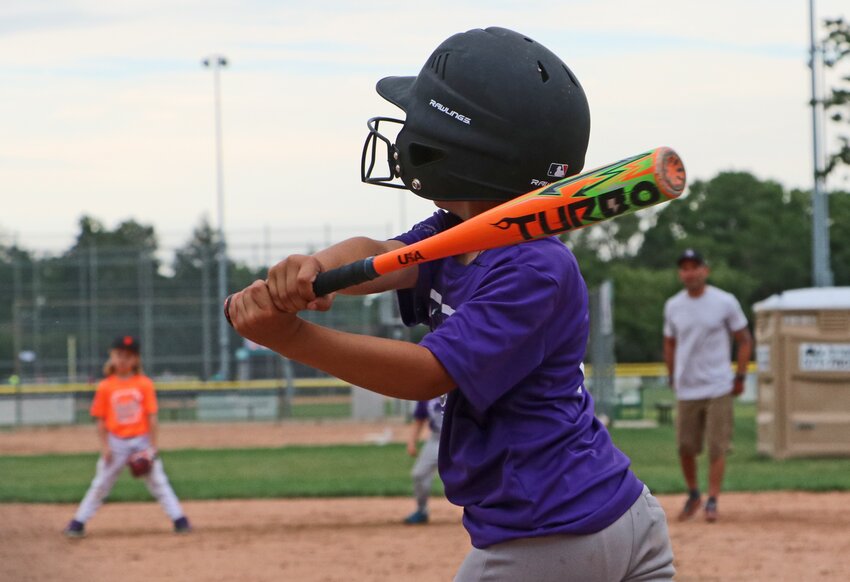 Blair Little League batter Kyrian Derrick takes a big swing Tuesday at the Youth Sports Complex.