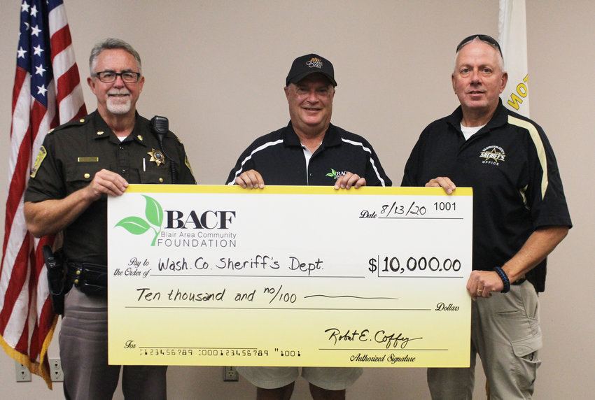 Bob Coffey, director of development for the Blair Area Community Foundation, presents a check for $10,000 to the Washington County Sheriff's Office. Accepting the check are Chief Deputy Kevin Willis, left, and Sheriff Mike Robinson, right. The funds were given by anonymous donors who wanted to help the sheriff's office with needed equipment that can't be budgeted for.