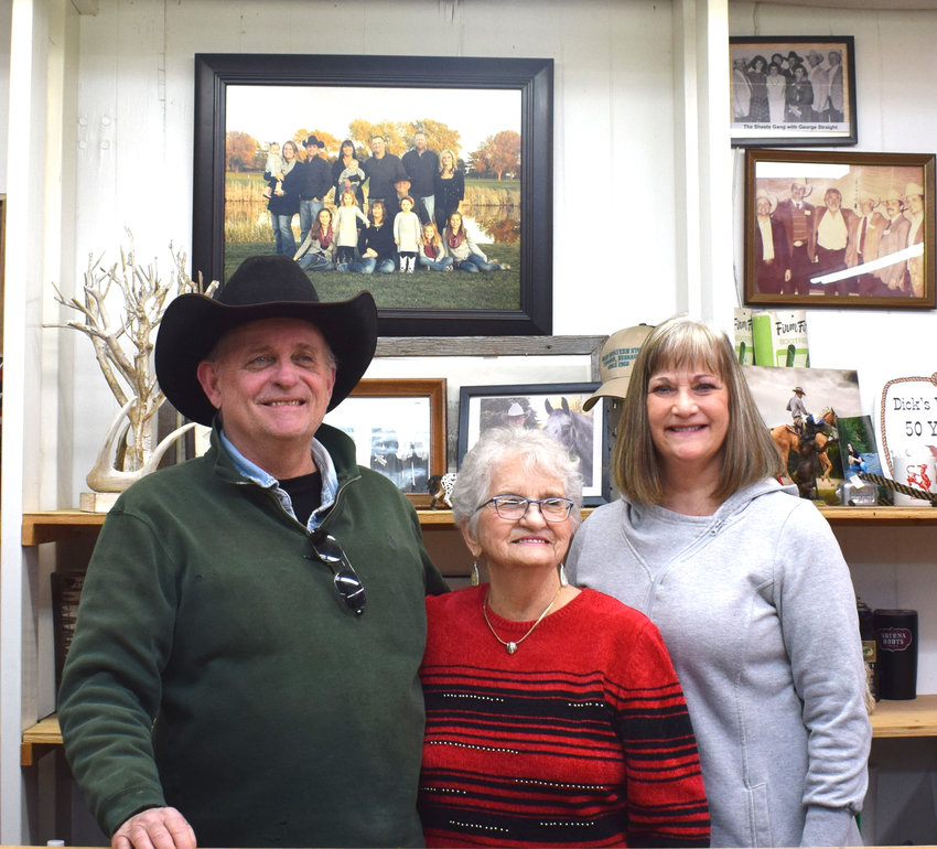 Floyd, Marge and Anne Sheets, owners of Dick's Western Store, stand behind the counter of the 52-year-old store before it closes.