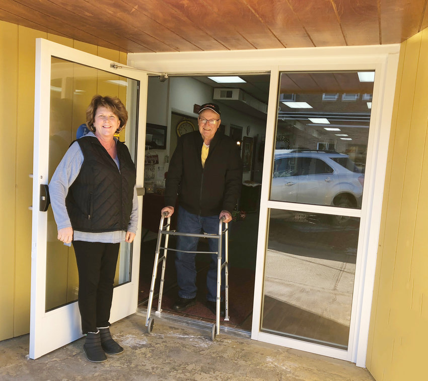 Friends of Oakland Foundation President Sue Beckner and Ed Anderson are pictured with the new entrance doors at the Golden Oaks Senior Center.  The doors were purchased with a grant from the Friends of Oakland Foundation.