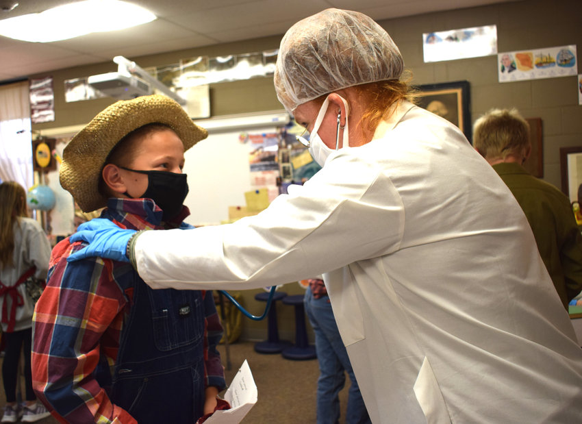 Owen Ladehoff gets his health check during the Ellis Island presentation on Monday.