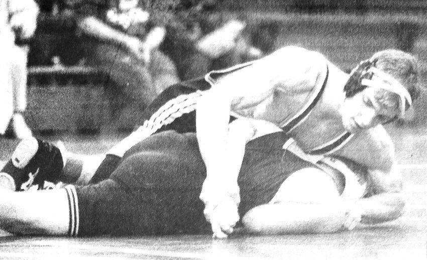 Monte Christensen of Fort Calhoun, top, tries to turn Arlington's Jake Clark during the 1993-94 season-opening dual. The Pioneers won 55-6.