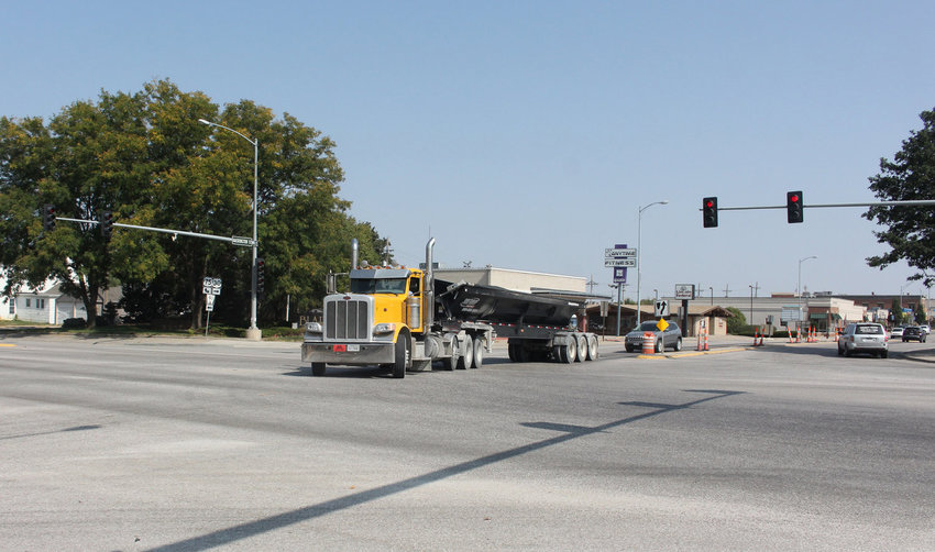 A semi-tractor trailer turns onto South 19th Street from Washington Street. The Nebraska Department of Transportation will make changes next week to traffic signals to allow more time for pedestrians to cross the streets.