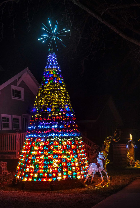 Kevin Clapper of Herman created this 22-foot tall Christmas tree by hand, using metal flashing and more than 1,000 lights. The tree sits in his front yard at 106 Eighth St.