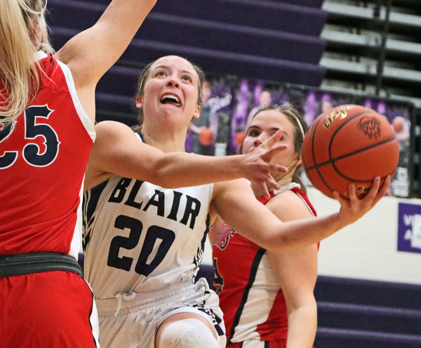 Bears junior Makayla Baughman drives to the basket and makes an acrobatic layup Saturday against Norris at Blair High School.
