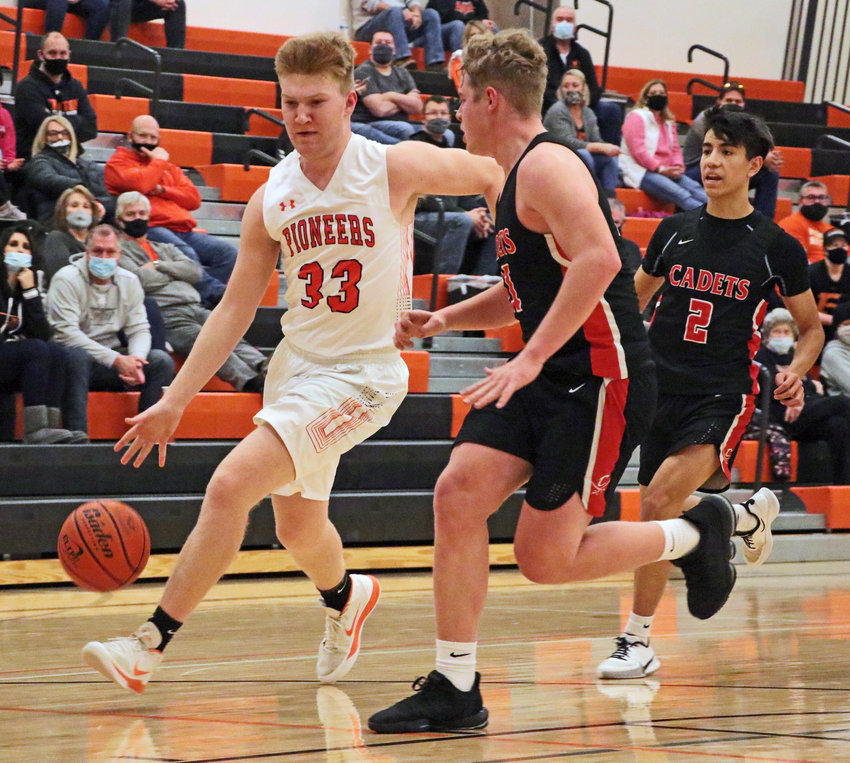 The Pioneers' Carsen Schwarz, left, tries to beat a pair of West Point-Beemer defenders to the bucket Saturday at Fort Calhoun High School.