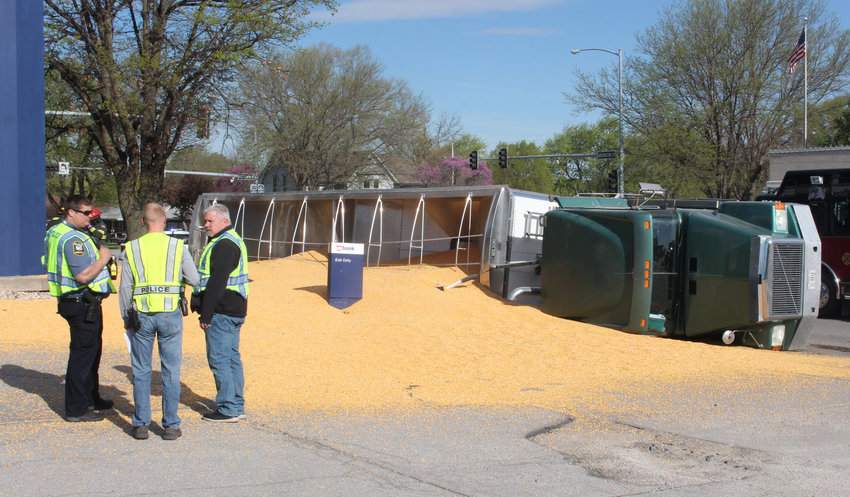 Blair police responded to the scene of a semi overturned at 19th and Washington on Friday morning in Blair. A load of corn was dumped on the corner during the accident.
