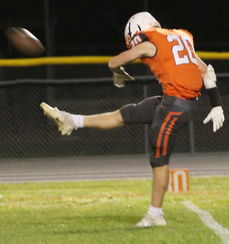 Jaxen Jorgensen punts the ball during the second half of the David City game Friday.