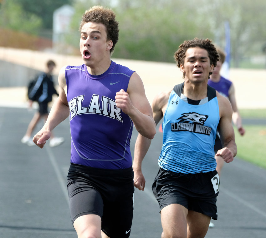 Blair junior Nolan Slominski, left, finishes the 400-meter dash ahead of Elkhorn North's Christian Young on Thursday during the Mike Lehl Invite at Krantz Field.