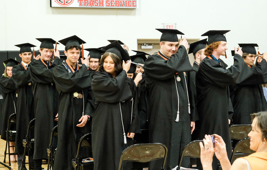 Fort Calhoun High School graduates turn their tassels following the presentation of diplomas Saturday afternoon during the commencement ceremony.